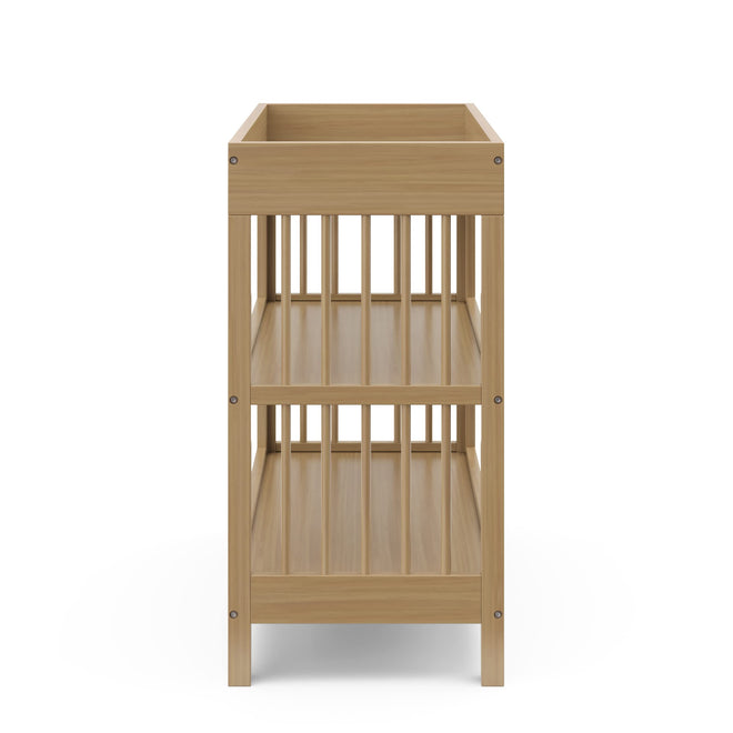 Graco Teddi Changing Table with Water-Resistant Changing Pad (Driftwood) - GREENGUARD Gold Certified, 2 Open Shelves, Includes Bonus Water-Resistant Changing Pad with Safety Strap 🍁 All In One Marketplace Canada